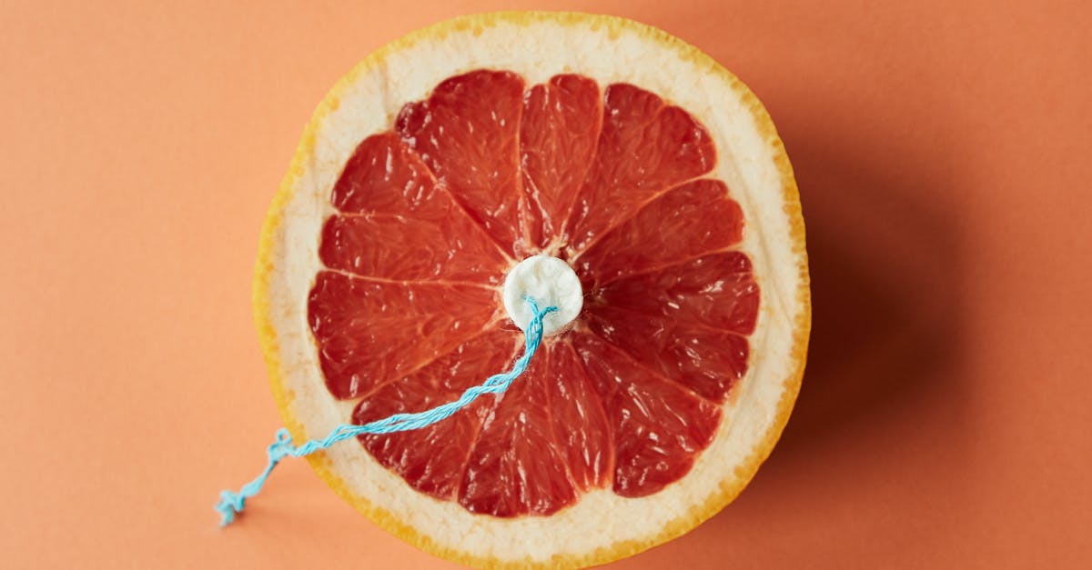 What equation should I use for microwaving food? - Sliced grapefruit with tampon as symbol of menstruation