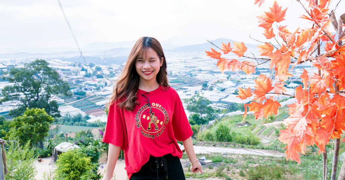What gives Vietnamese Chicken the red tint? - Woman in Red T-shirt and Black Shorts