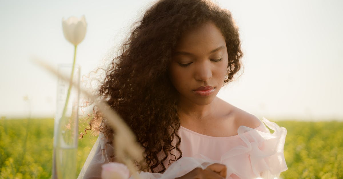 What happens chemically when flavours 'mingle'? - Young Woman with Long Curly Hair Creating New Natural Perfumes and Flavours