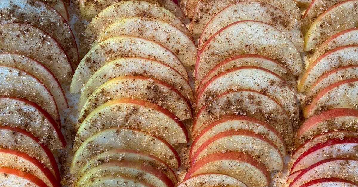 What happens when you bake Winesap apples? - Closeup of delicious homemade pie with rows of slices of apples covered with sugar and cinnamon
