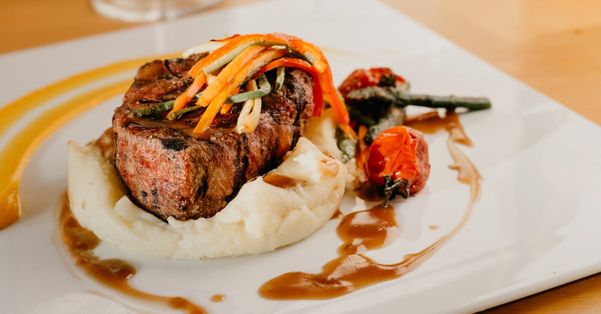 What ingredients to use to prevent steak from drying out on the grill? - Delicious beefsteak garnished with puree in restaurant