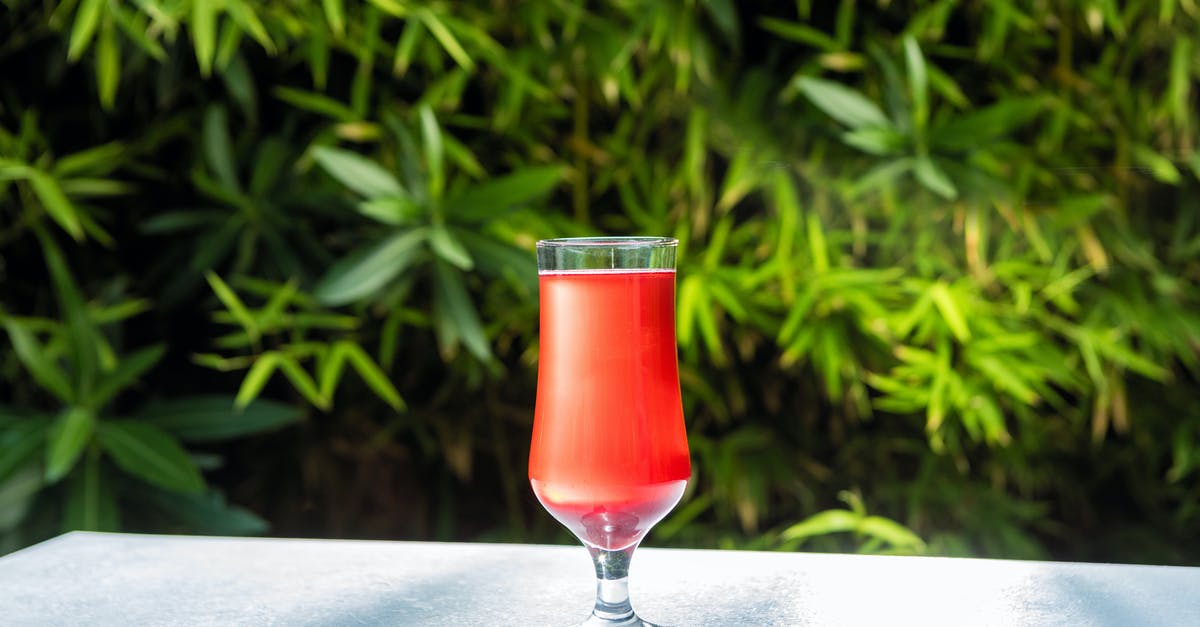 What is 100% juice? - Clear Wine Glass With Red Liquid on White Table