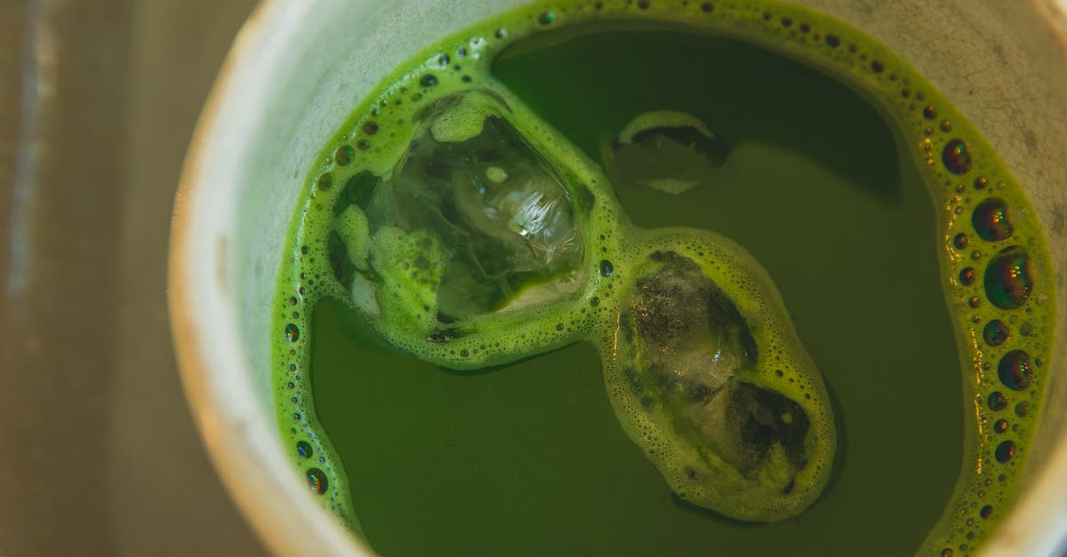 What is a good technique to make Iced Tea? - Close-Up Photo of Iced Matcha Drink