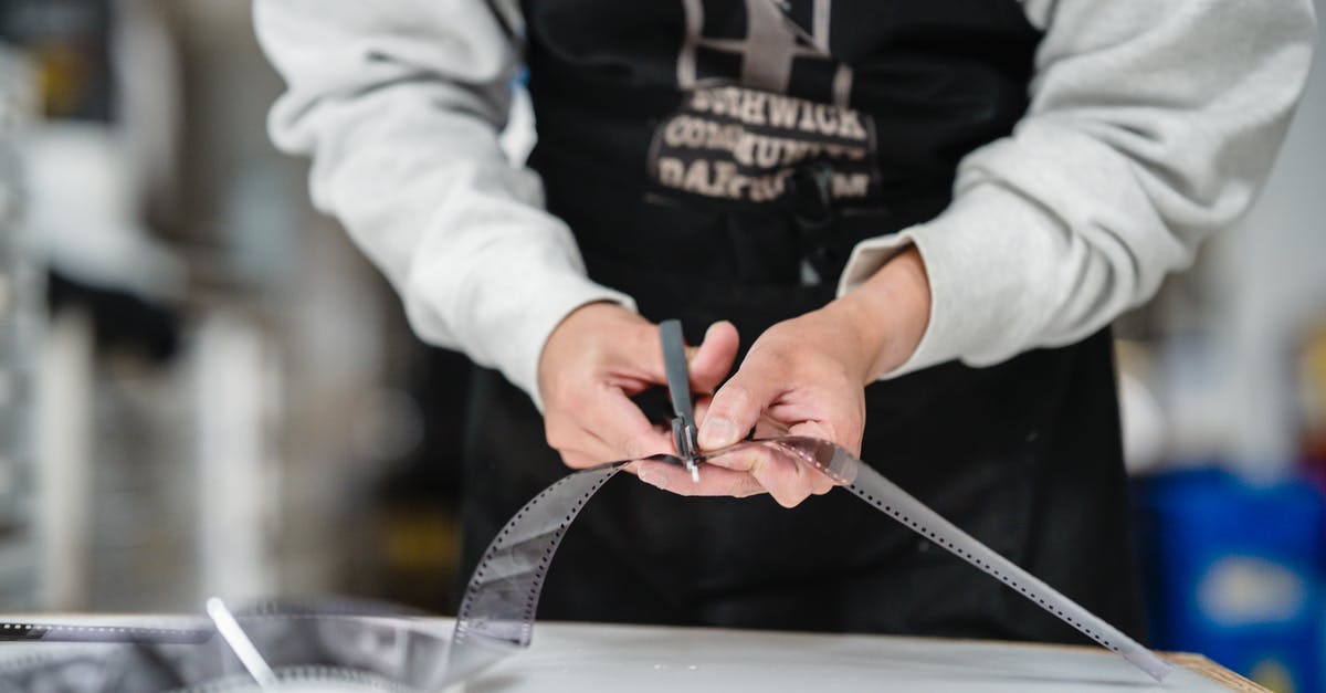 What is a julienne cut? - Person in White Jacket Holding Silver Scissors