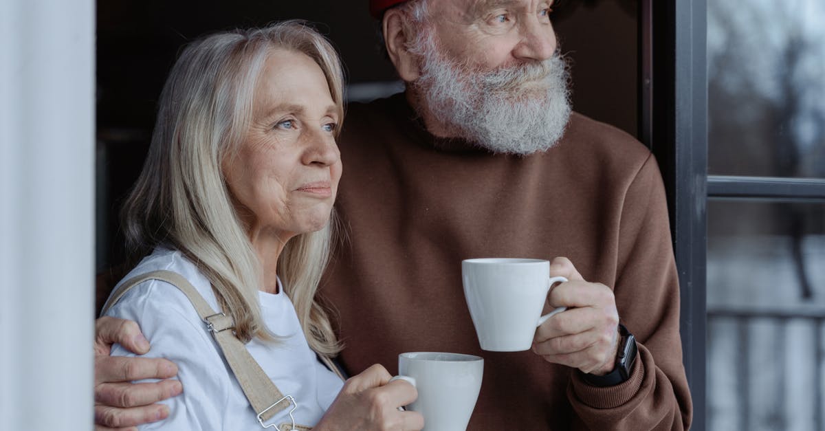 What is a “small cup” in Australia and/or old recipes? - Man and Woman Holding White Ceramic Mugs