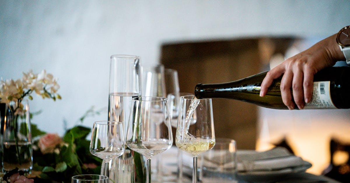 What is a liqueur? - Photo Of Person Pouring Liqueur On Wine Glass