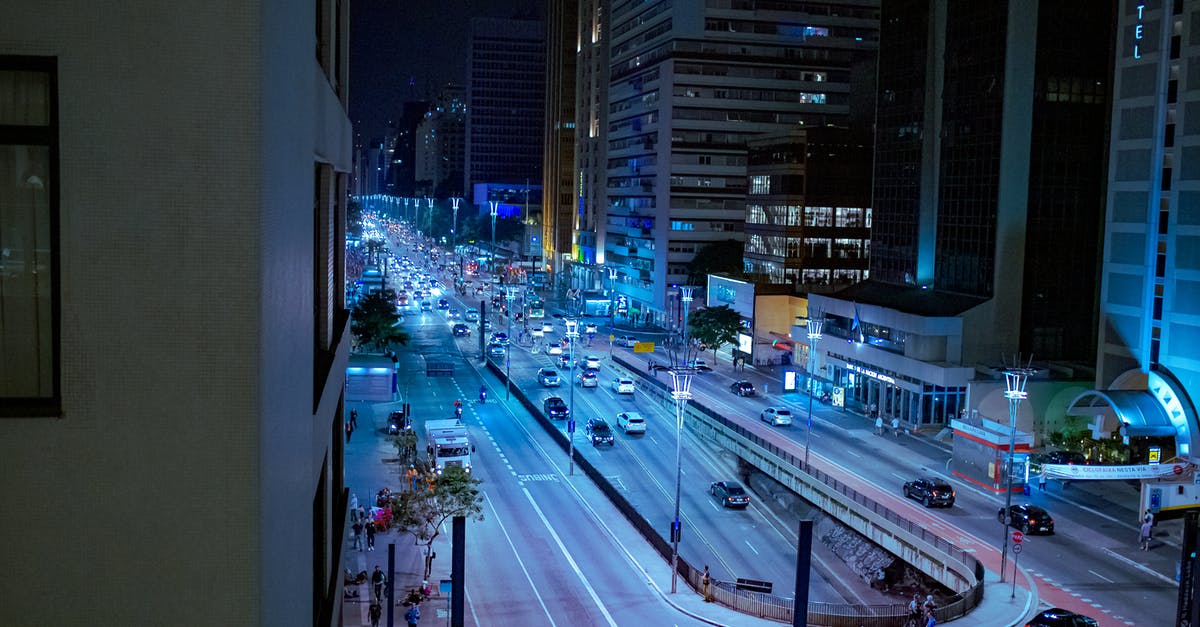 What is an easy way to turn a heavy-ish cake? - Modern city street with road at night time