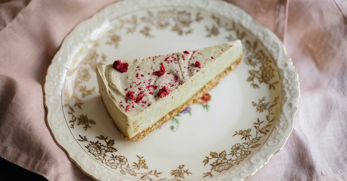 What is caster/castor sugar? - Cheesecake Triangle Sprinkled with Red Castor Sugar Laying on Ornamental Plate