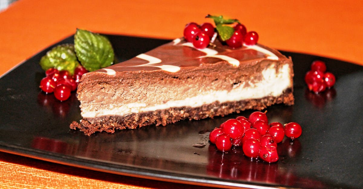 What is in a Jamaican Chocolate Cheesecake? - Rasp Berry Cake on Black Plate