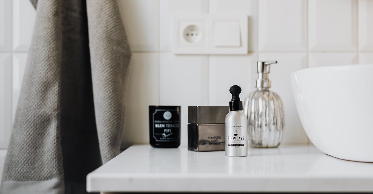 What is Light Cream - Personal care supplies on cabinet in stylish bathroom