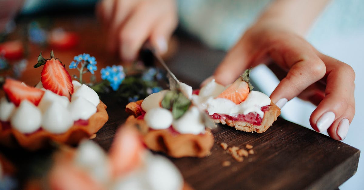 What is Light Cream - Unrecognizable woman cutting delicious dessert