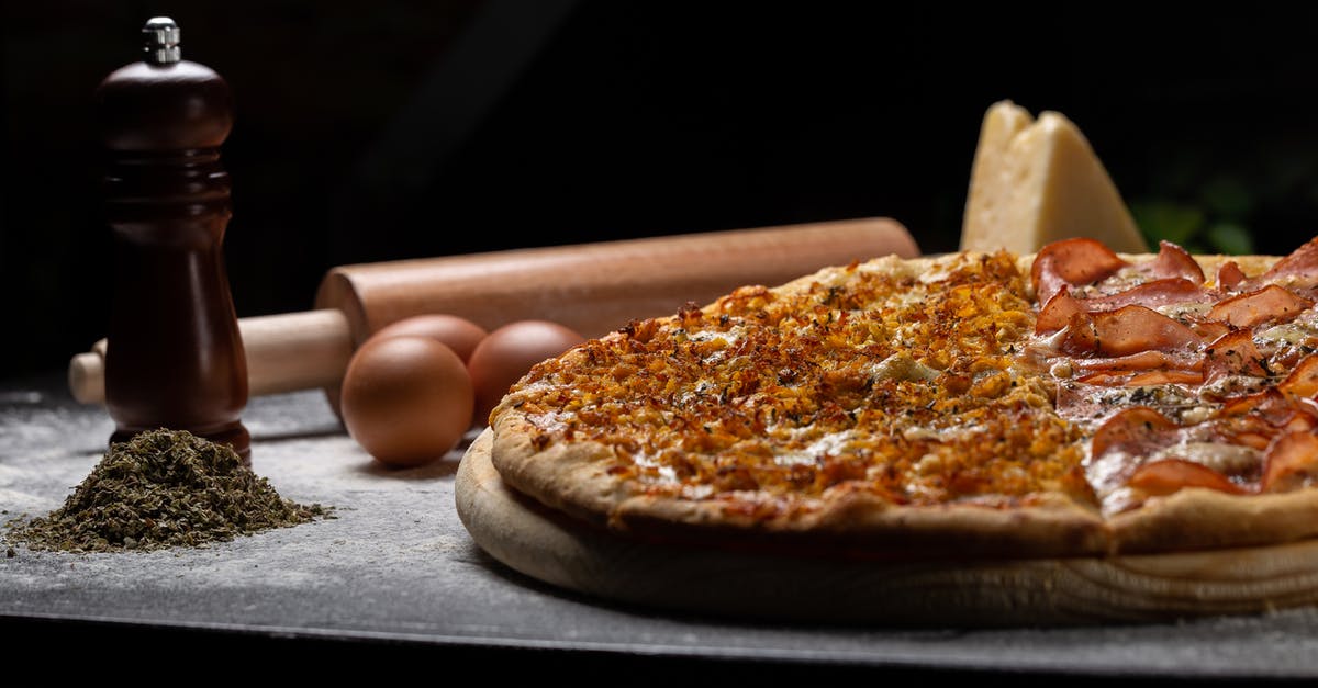 What is meant when a spice is water-soluble? - Pizza on Wooden Board Beside Eggs and Rolling Pin