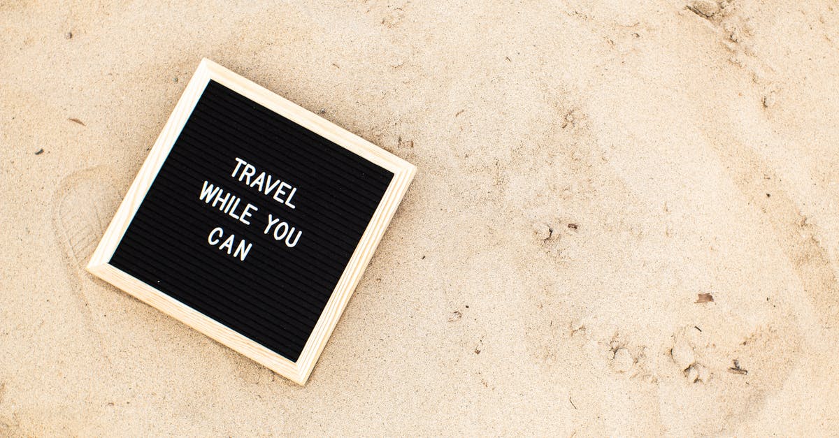 What is "fine ground cornmeal"? - A Letter Board with Travel While You Can on the Beach Sand