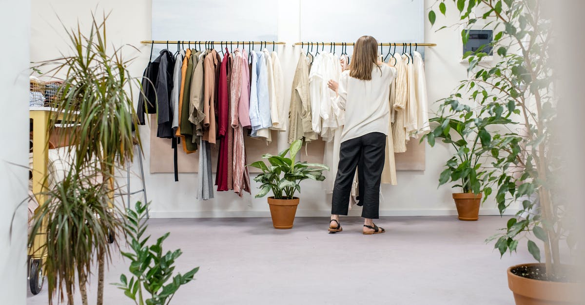 What is room temp Butter - Woman Fixing Clothes on the Rack