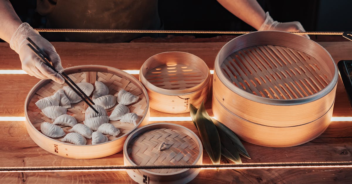 What is the 'Steam-Chill-Bake' method of making hot wings? - White Round Ceramic Bowl on Brown Wooden Tray