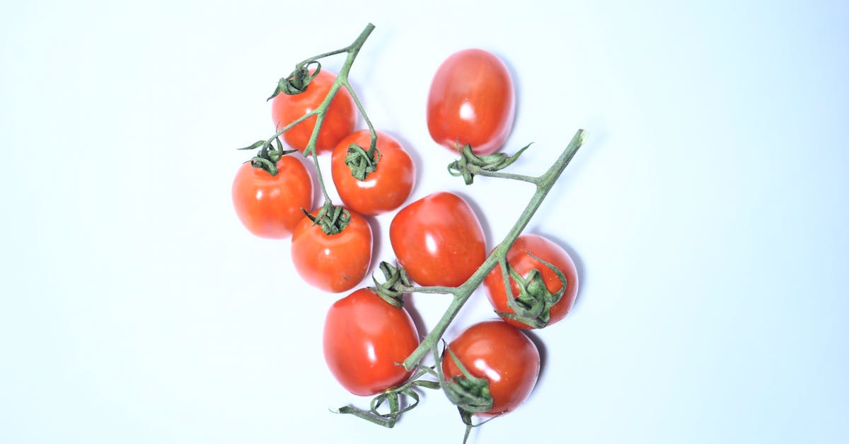 What is the alternative to a vine ripened tomato? - Heap of red tomatoes on branch