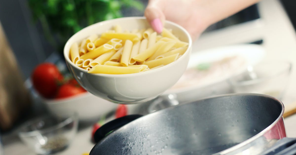 What is the benefit of a pasta pot with an inset? - Person Holding White Ceramic Bowl