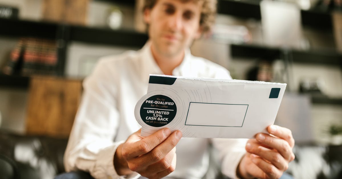 What is the benefit of a tinfoil packet? - Man in White Dress Shirt Holding White Envelope