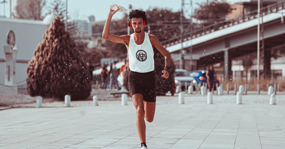 What is the best culinary practice surrounding the water used to soak beans, pulses and rice? - Young male athlete pouring water while running in park
