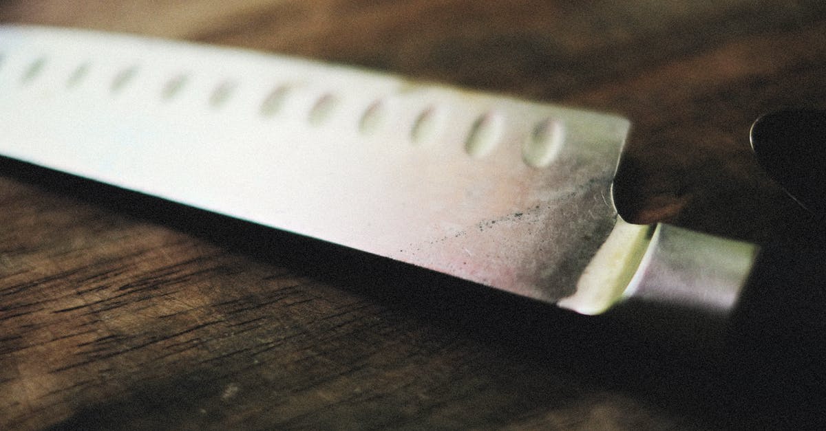 What is the best utensil kit for the cost? [closed] - Close-Up Shot of a Kitchen Knife on Wooden Surface