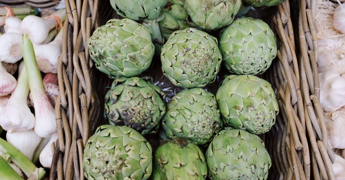 What is the best way to store prepared raw vegetables - Organic green artichokes for sale in local market