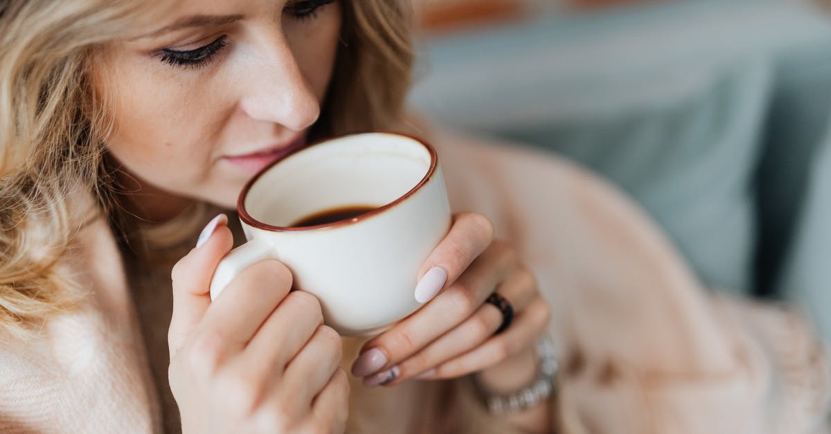 What is the definition of a cup of coffee - Woman Drinking Coffee