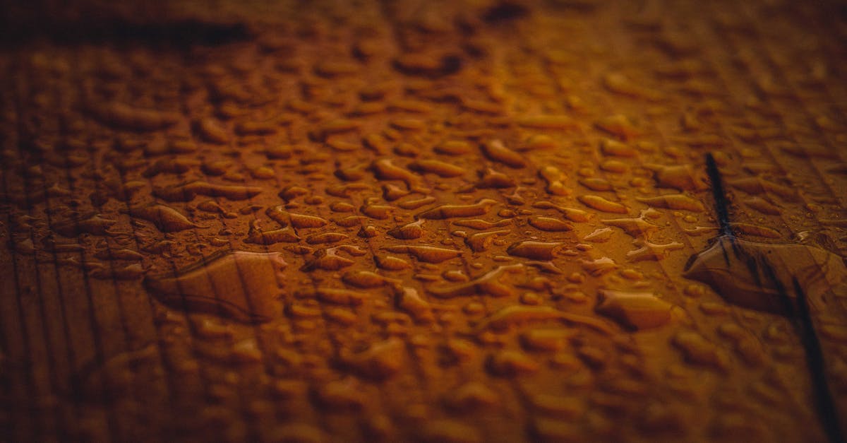 what is the difference between butter spread and pure butter? - Textured background of pure water drops on ribbed surface