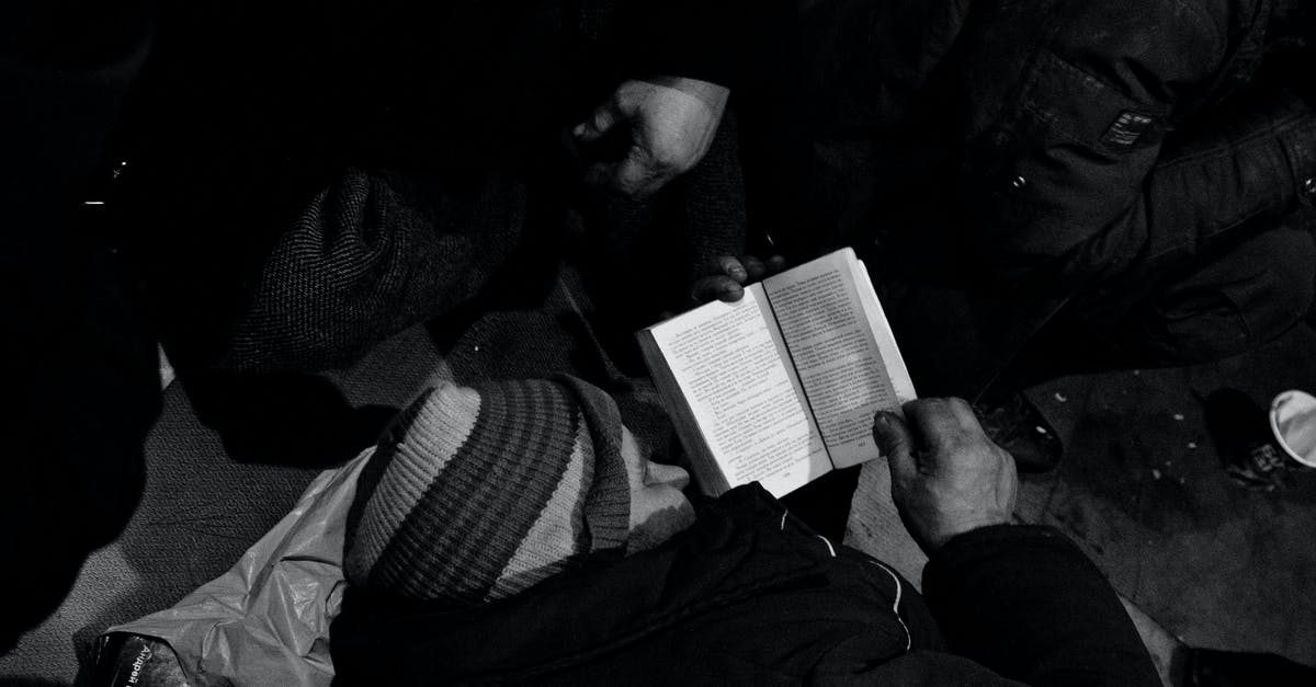 What is the difference between fondue and cheese sauce? And do both need to be kept warm to be remain melted? - Black and white of homeless man lying on floor and reading book in night shelter for homeless