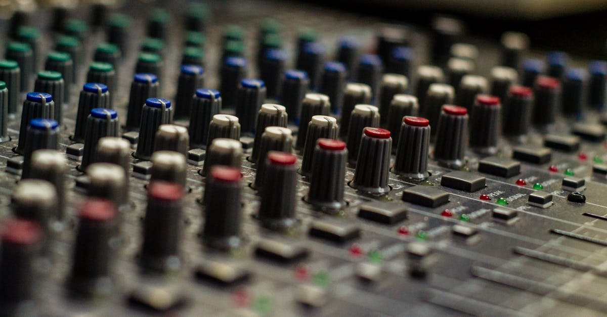 What is the difference between green, white and black tea? - Sound mixer with rows of knobs in recording studio