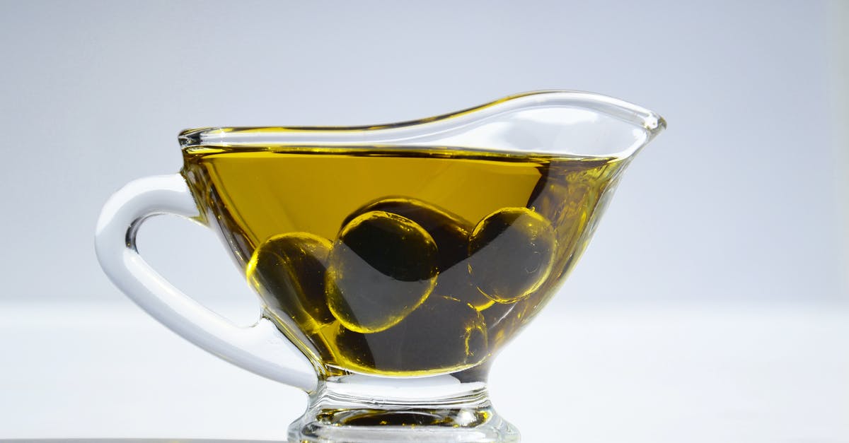 What is the difference between normal oils and cooking oils? - Photo of Olives on Cup of Olive Oil