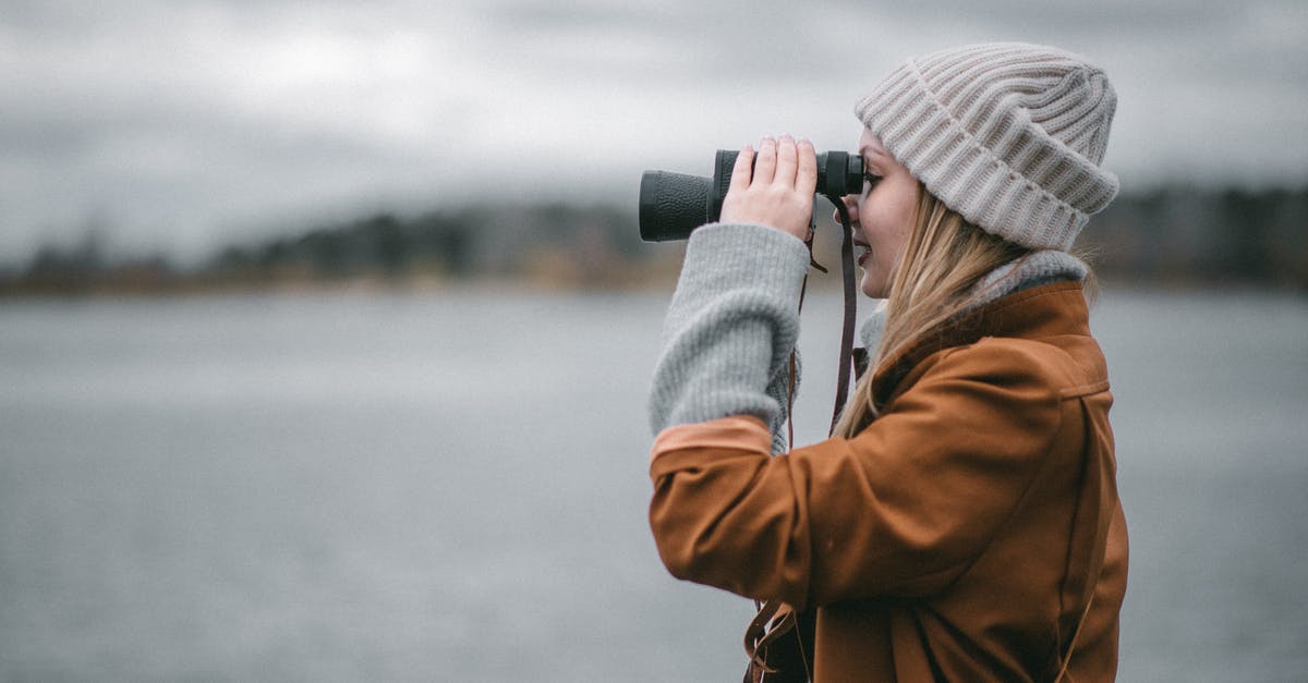 What is the difference between using hot water and cold water when making regular pastry? - Side view of female in warm clothes smiling and using binoculars on blurred background of embankment What is the difference between using hot water and cold water when making regular pastry? - Side view of female in warm clothes smiling and using binoculars on blurred background of embankment