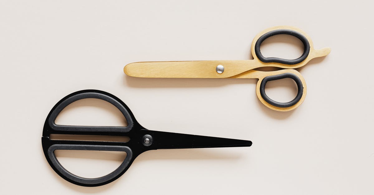 What is the difference between various cuts of steak? - Top view of multicolored scissors of different shape on beige table