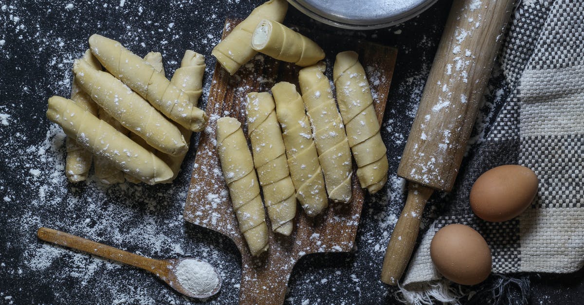 What is the effect of adding eggs to a pastry dough? - Homemade Pastry on Wooden Board and Baking Utensils