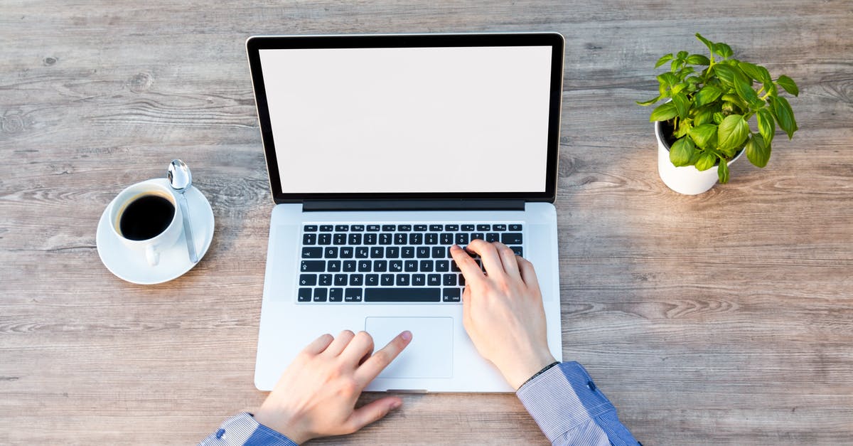 What is the film on top of tea? - Person's Hand on Laptop