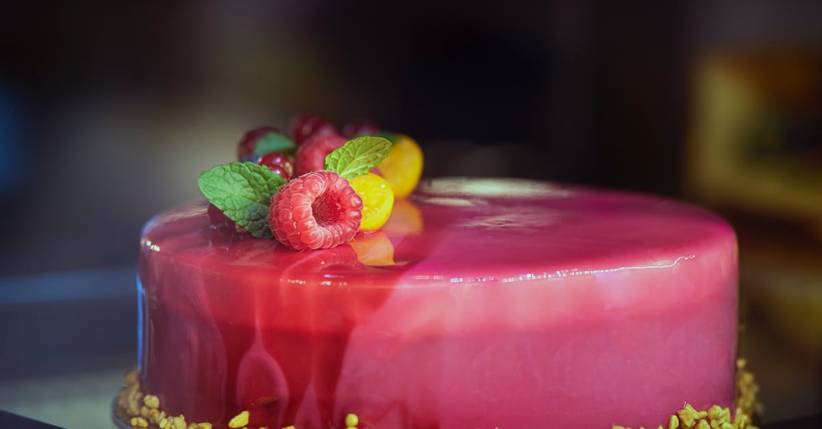 What is the glaze on a bakery-style fruit tart? - Delicious mirror glaze cake decorated with assorted berries