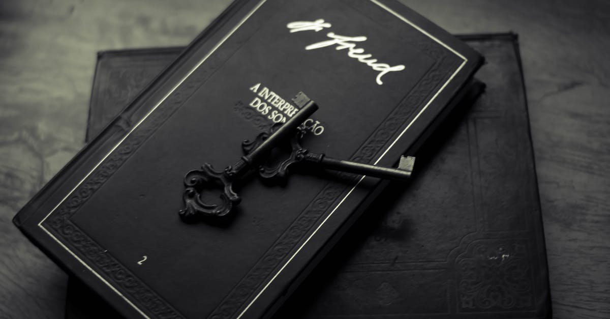 What is the Key Difference Between Nougat and Meringue? - From above of classic metal key placed on black books on wooden table