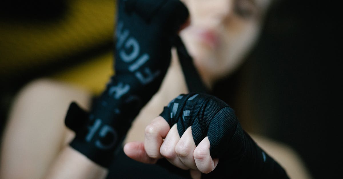 What is the name for this technique to prepare eggs? - Soft focus of crop woman bandaging hands and wrists with boxing wraps on blurred background