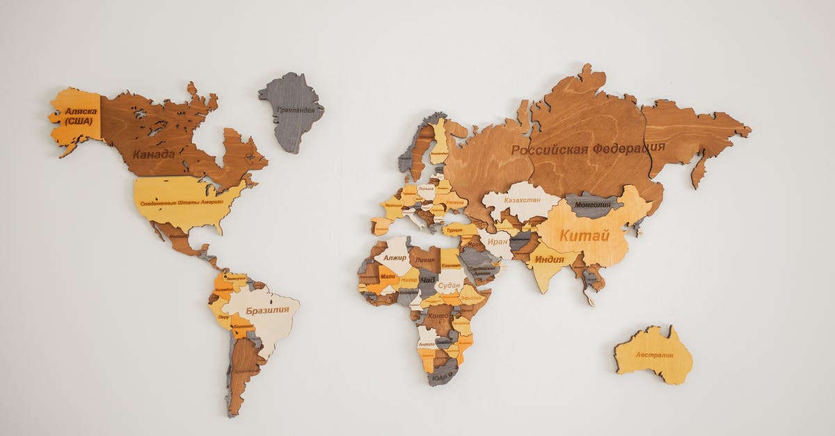 What is the name of this style of knife? - Decorative creative wooden world continents with country names written in Cyrillic attached on white background in light room of studio