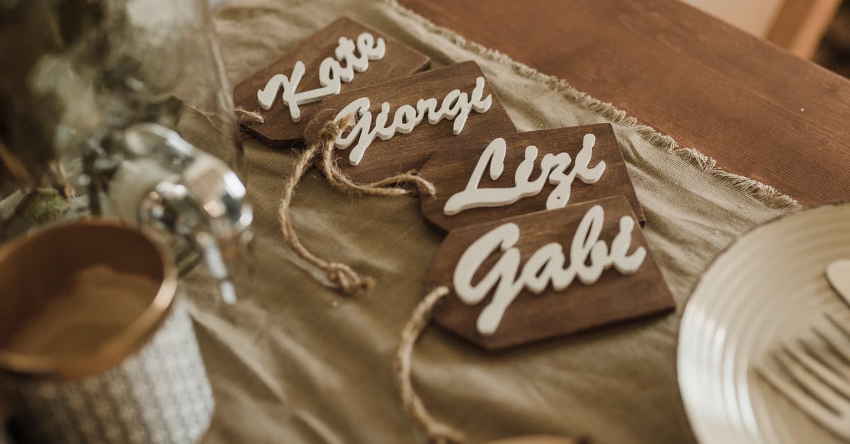 What is the name of this style of knife? - Wooden name tags arranged on table during wedding ceremony