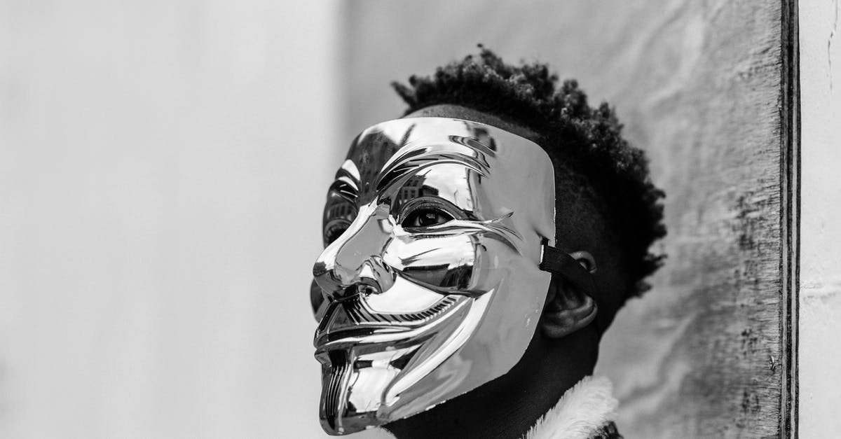 What is the opposite of cuvée? - Black activist wearing Anonymous mask as sign of protest