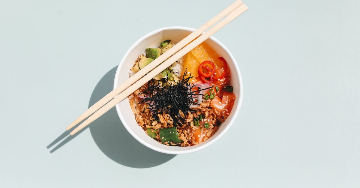 What is the origin of spam musubi, a Hawaiian dish? - Photo of Wooden Chopsticks on a Poke Bowl