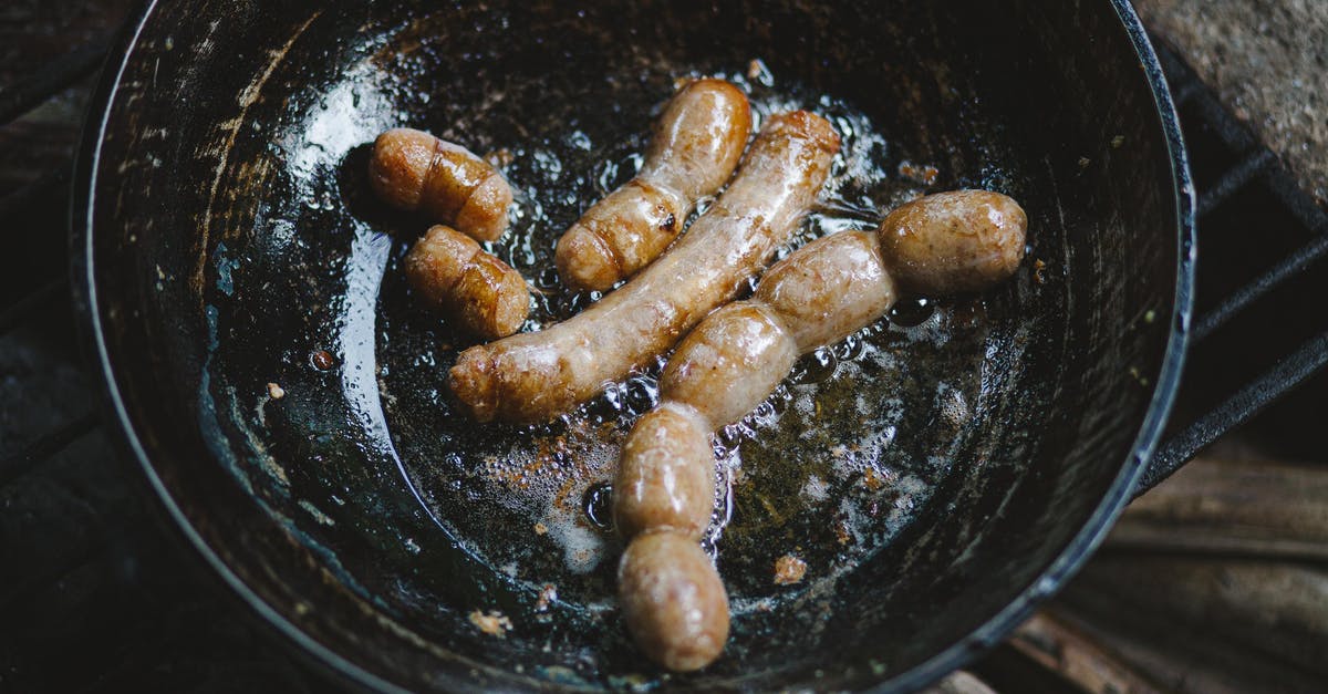 What is the point of frying and then poaching a sausage? - Sausages in a Black Wok 