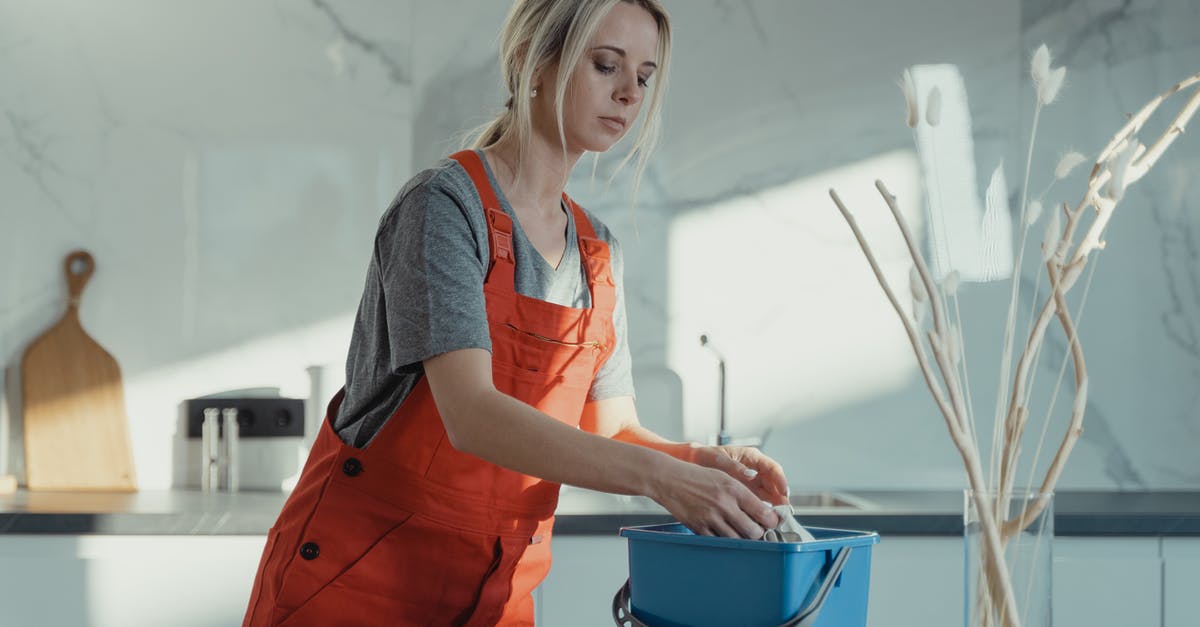 What is the preferred method for sanitizing the kitchen? - A Cleaner Working