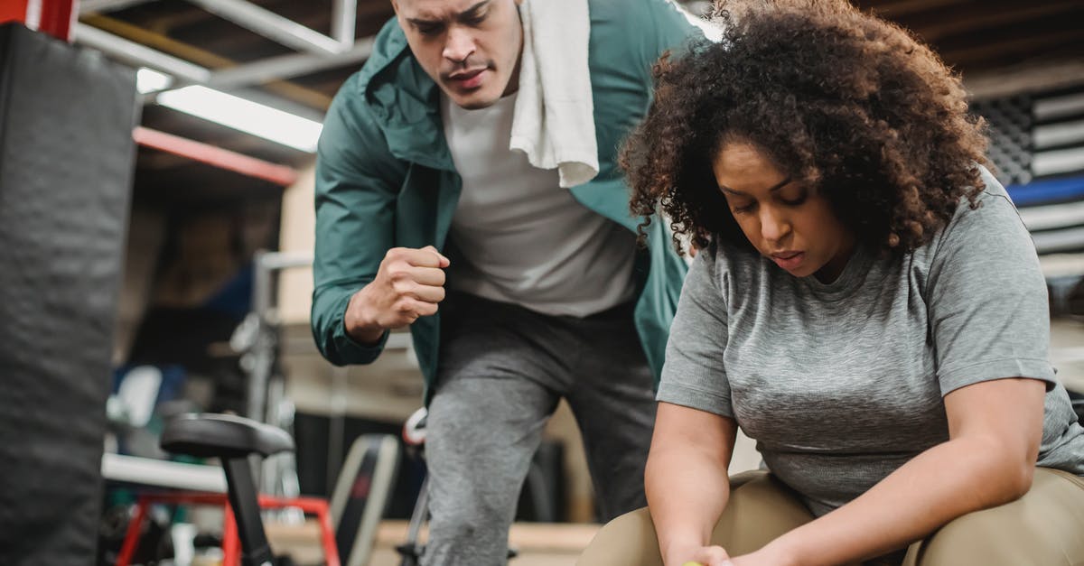 What is the proper volume to weight conversion for Bisquick? - From below of strong personal coach explaining black woman how to exercise with dumbbells properly