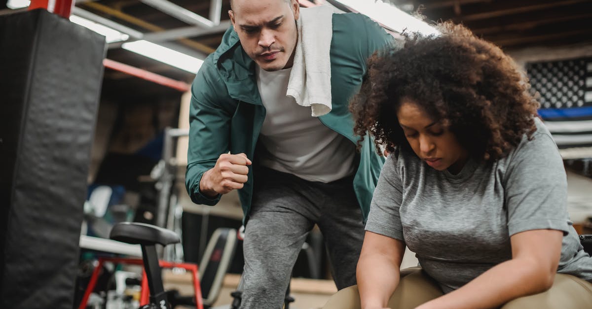 What is the proper volume to weight conversion for Bisquick? - African American trainer working with black female client during training in modern gym