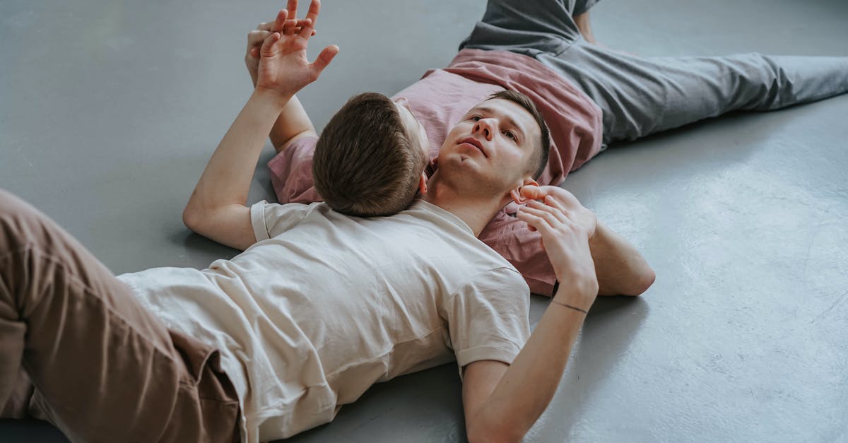 What is the relationship (if any) between natto and miso paste? - Photograph of Men Lying on a Gray Floor