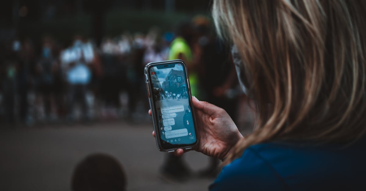 What is the right use of bake and broil? - Crop woman with smartphone near protesters during manifestation