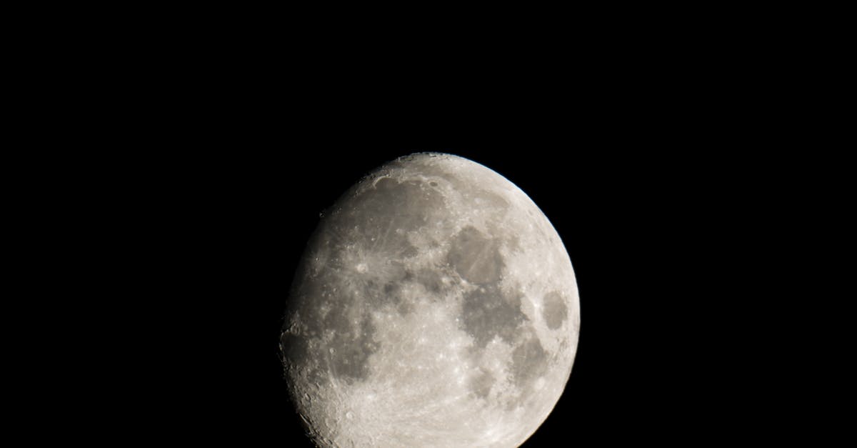 What is the science behind Magic Cake? - Black and white of grey craters on surface of big bright round glowing waxing Moon on black background