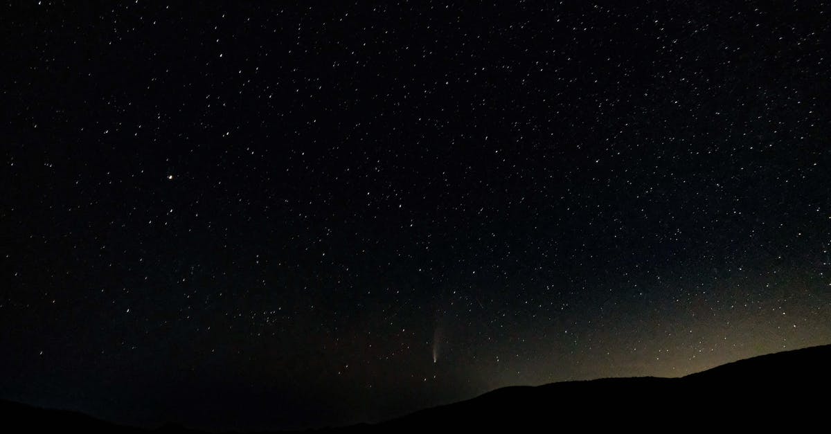 What is the science behind Magic Cake? - Low angle of spectacular night sky with luminous stars and falling comet over dark mountainous terrain