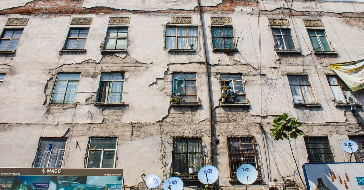 What is the sign of mozzarella being old? - Facade of an Old Apartment Building